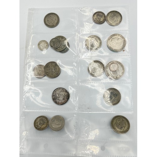 2245C - A collection of coins and medals to include twenty four .500 silver half crowns etc.