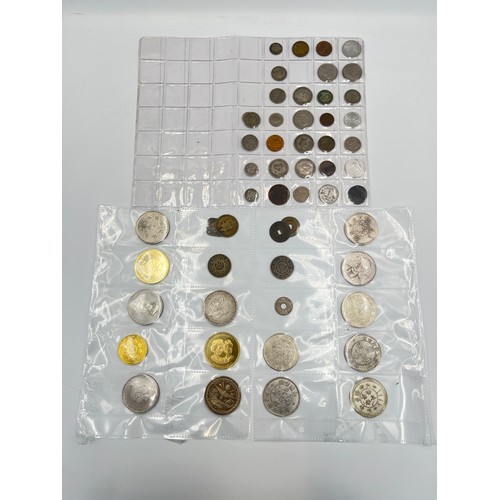 2245E - A collection of coins to include Chinese silver 1 yuan, Japanese silver 50 sen, two .925 silver thre... 