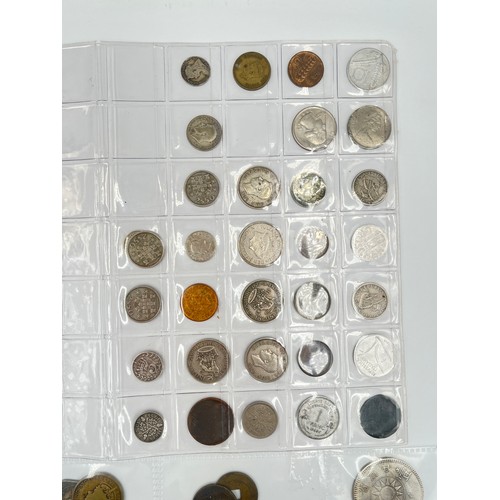 2245E - A collection of coins to include Chinese silver 1 yuan, Japanese silver 50 sen, two .925 silver thre... 