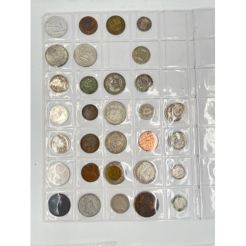 2245E - A collection of coins to include Chinese silver 1 yuan, Japanese silver 50 sen, two .925 silver thre... 