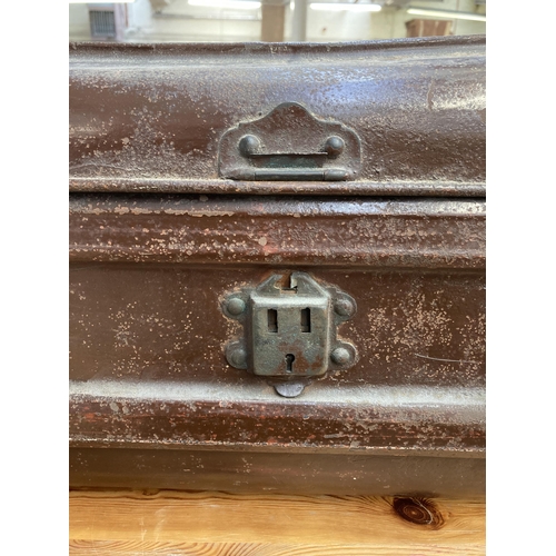 210 - An early 20th century brown metal travel trunk - approx. 30cm high x 55cm wide x 30cm deep