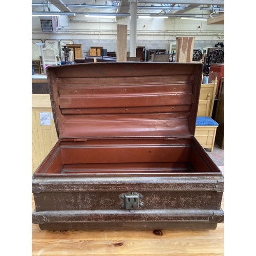 210 - An early 20th century brown metal travel trunk - approx. 30cm high x 55cm wide x 30cm deep