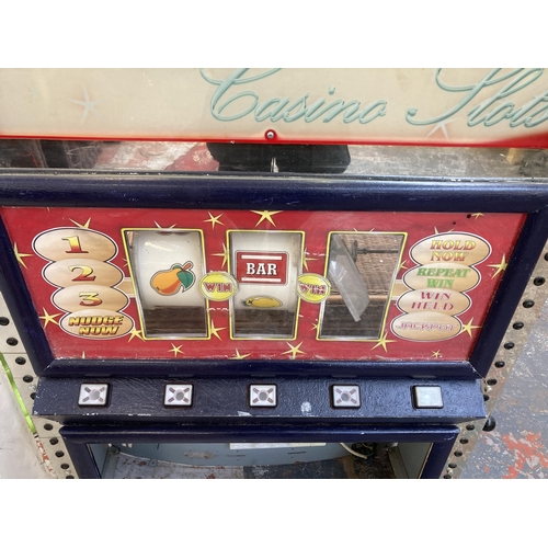 220 - A Reels Casino Slots metal and plastic slot machine - approx. 145cm high x 86cm wide x 31cm deep