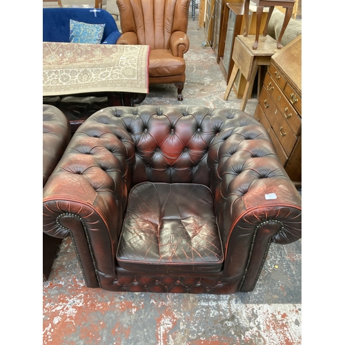 222 - A pair of oxblood leather Chesterfield club chairs