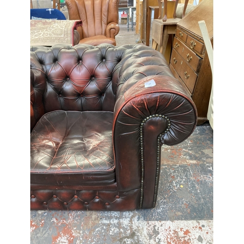 222 - A pair of oxblood leather Chesterfield club chairs