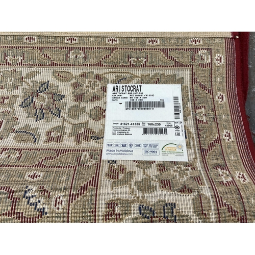 225 - An Aristocrat red rug - approx. 230cm x 160cm