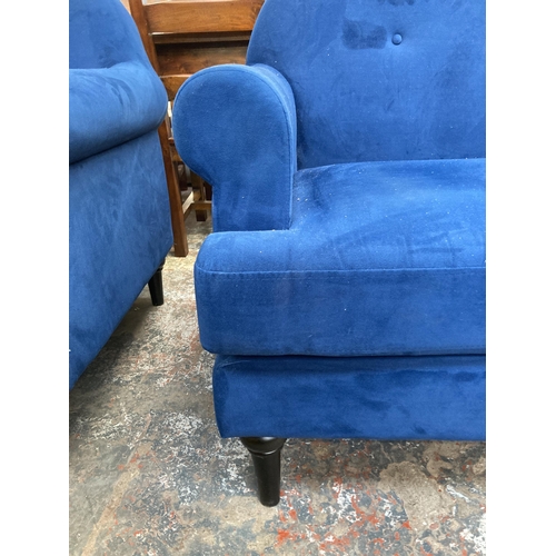 228 - A Victorian style blue fabric upholstered two seater sofa