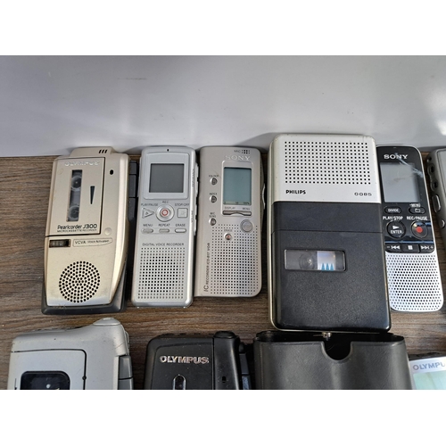 656 - A collection of voice recorders to include Olympus Pearlcorder S701 microcassette, Grundig DMC-68 mi... 