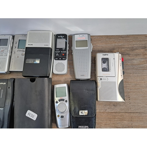 656 - A collection of voice recorders to include Olympus Pearlcorder S701 microcassette, Grundig DMC-68 mi... 