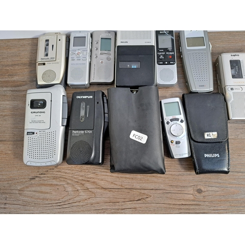 656 - A collection of voice recorders to include Olympus Pearlcorder S701 microcassette, Grundig DMC-68 mi... 