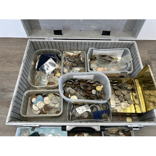 486 - An aluminium flight case containing a very large collection of world coins