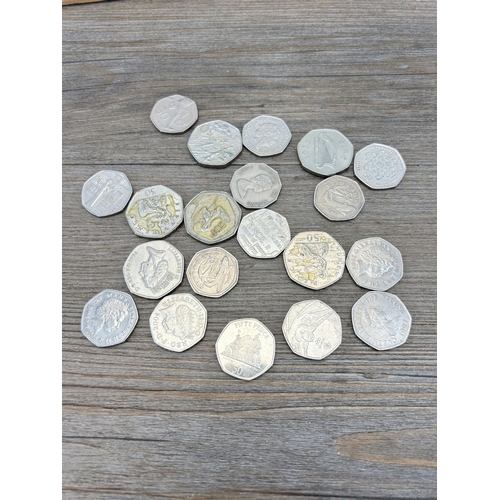 489 - A large collection of coins and collectables to include packaged pre-decimal sets, commemorative coi... 