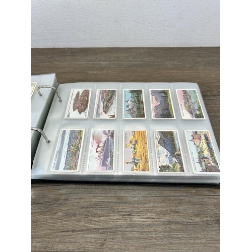 493 - A cigarette card album containing a large collection of various cigarette cards