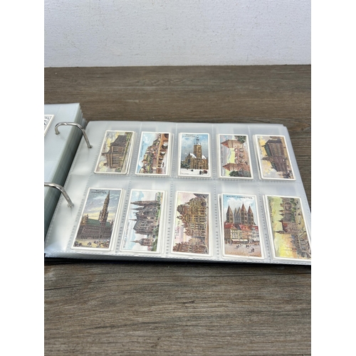 493 - A cigarette card album containing a large collection of various cigarette cards