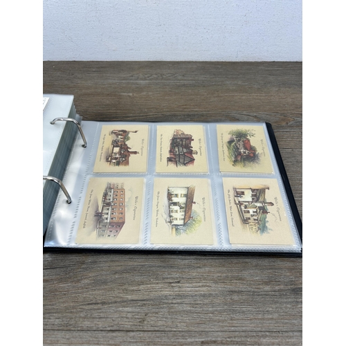 493 - A cigarette card album containing a large collection of various cigarette cards