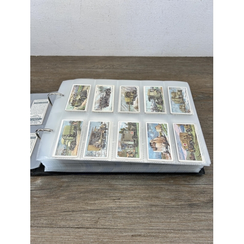 493 - A cigarette card album containing a large collection of various cigarette cards