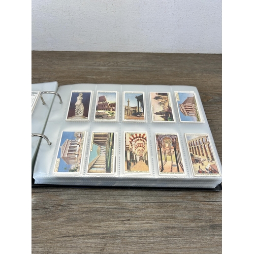 493 - A cigarette card album containing a large collection of various cigarette cards