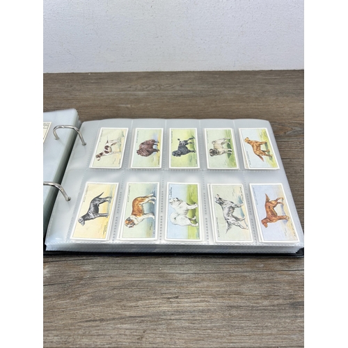 493 - A cigarette card album containing a large collection of various cigarette cards