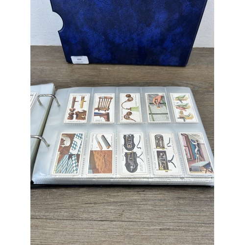 494 - A cigarette card album containing a large collection of various cigarette cards