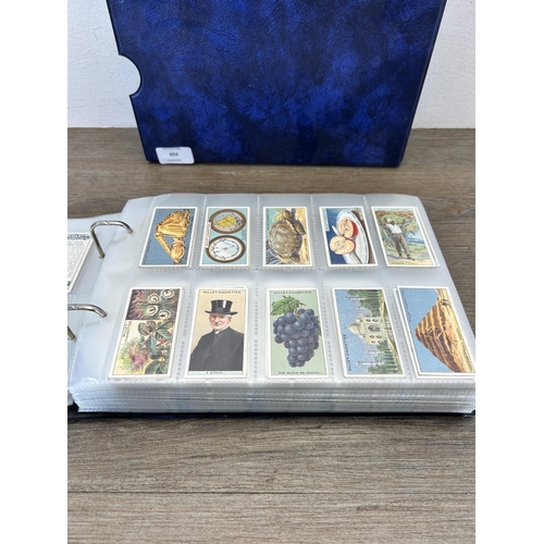 494 - A cigarette card album containing a large collection of various cigarette cards