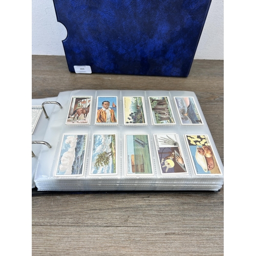 494 - A cigarette card album containing a large collection of various cigarette cards