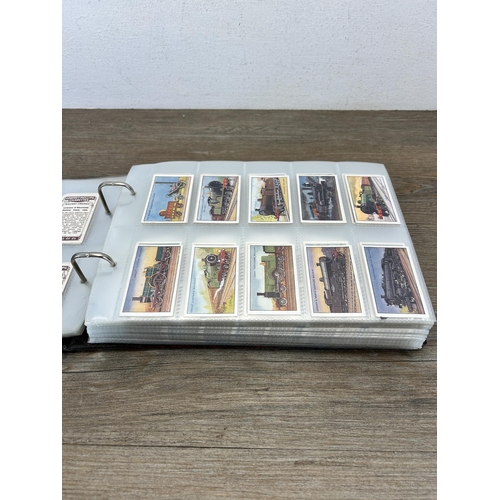 495 - A cigarette card album containing a large collection of various cigarette cards