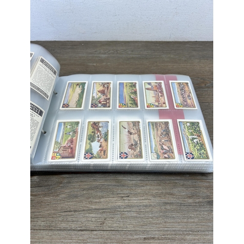 495 - A cigarette card album containing a large collection of various cigarette cards