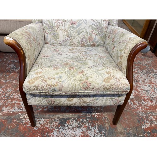 230 - A mid 20th century Parker Knoll PK750 beech and floral fabric upholstered wingback armchair