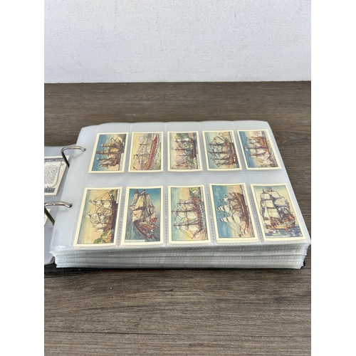 497 - A cigarette card album containing a large collection of various cigarette cards