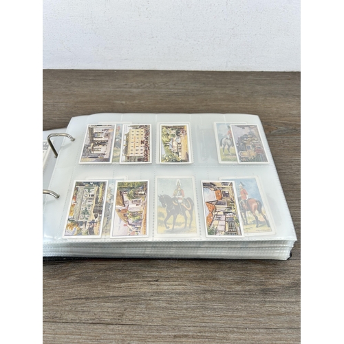 497 - A cigarette card album containing a large collection of various cigarette cards