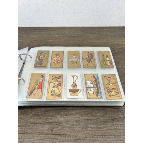 497 - A cigarette card album containing a large collection of various cigarette cards