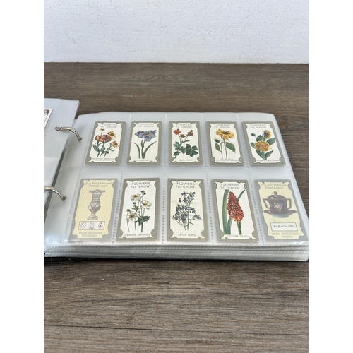 497 - A cigarette card album containing a large collection of various cigarette cards