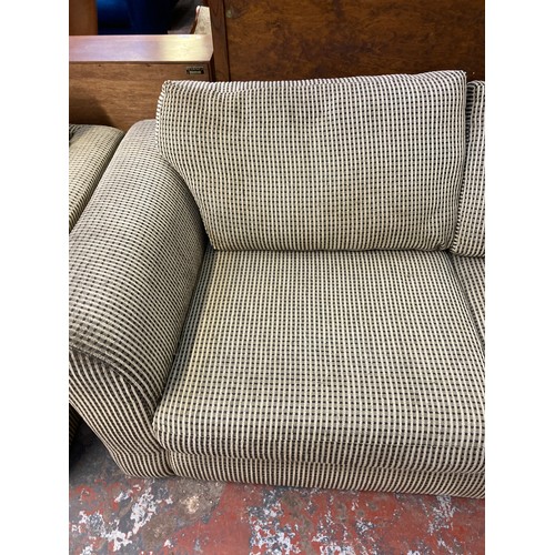 204 - A modern fabric upholstered three seater sofa