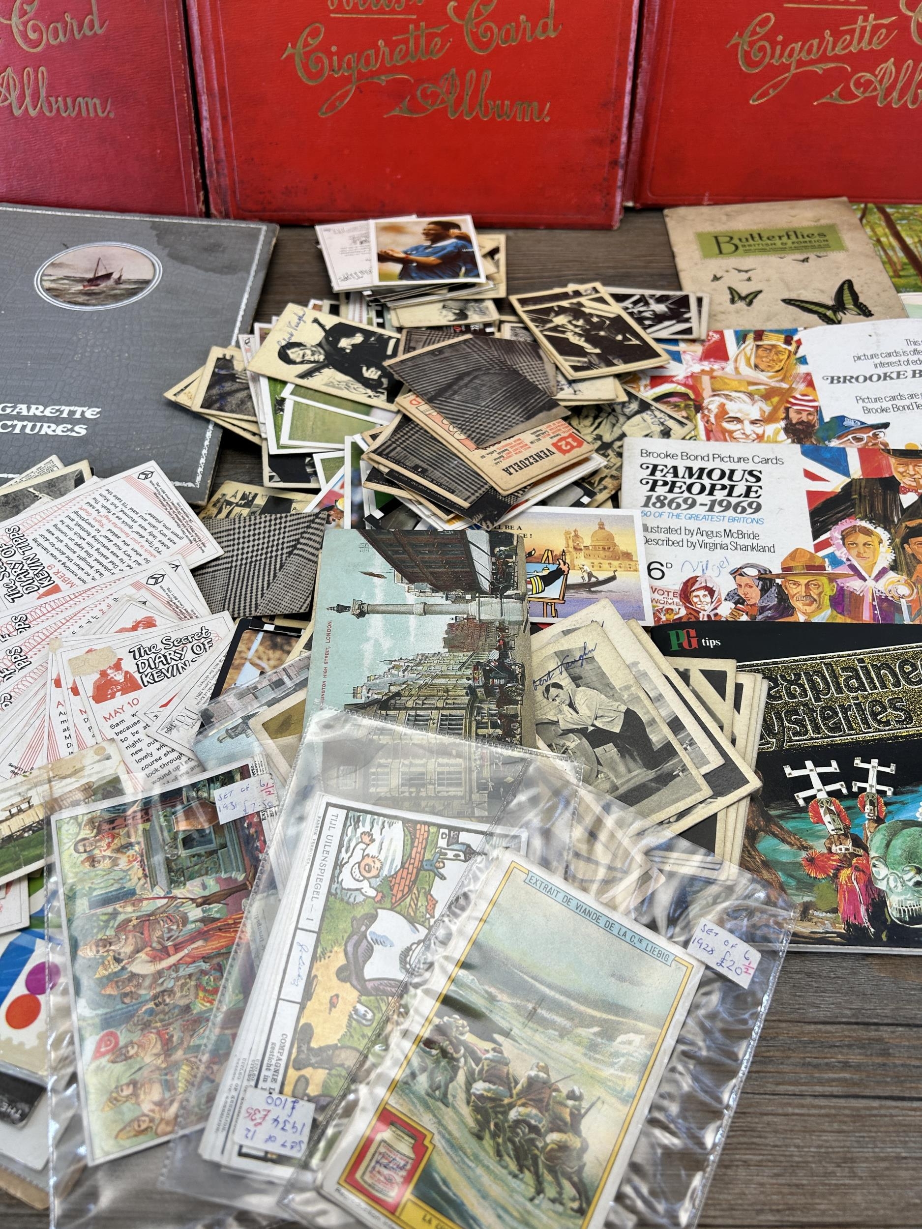 A large collection of vintage picture cards and picture card albums