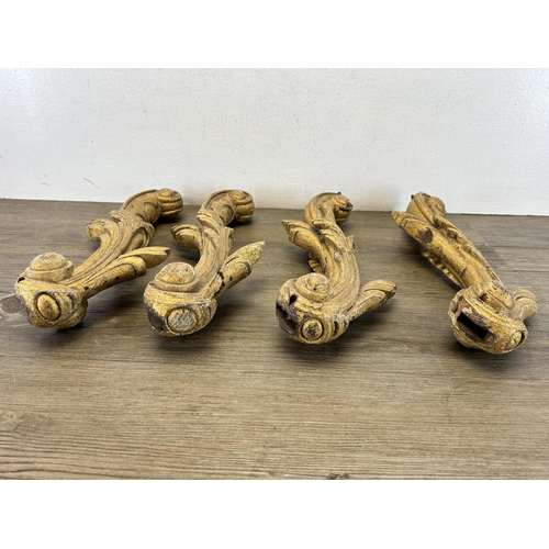 545 - Four Rococo gilded oak heavily carved brackets - approx. 40cm high