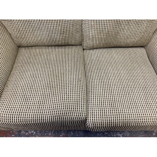 203 - A modern fabric upholstered two seater sofa