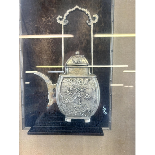 553 - A framed Oriental pewter teapot