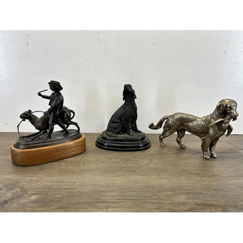 558 - Three cast metal dog sculptures