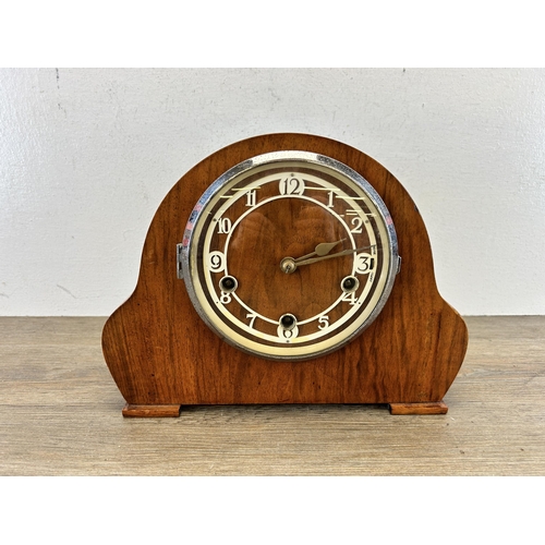 560 - A mid 20th century walnut cased chiming mantle clock