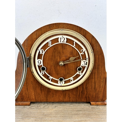 560 - A mid 20th century walnut cased chiming mantle clock