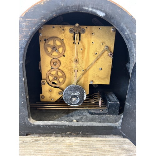 560 - A mid 20th century walnut cased chiming mantle clock