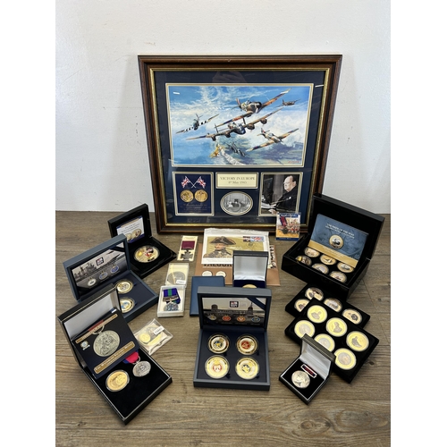 568 - A collection of coins and medals to include framed limited edition 009/299 'Victory in Europe 8th of... 