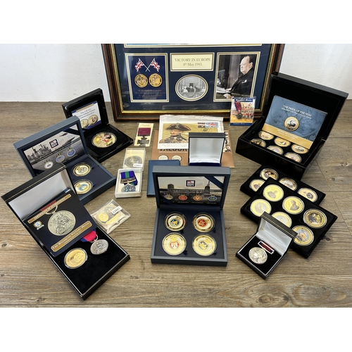 568 - A collection of coins and medals to include framed limited edition 009/299 'Victory in Europe 8th of... 