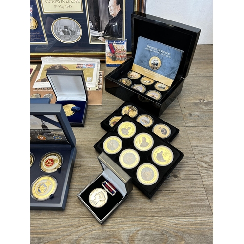 568 - A collection of coins and medals to include framed limited edition 009/299 'Victory in Europe 8th of... 