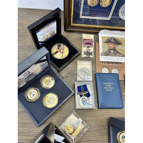 568 - A collection of coins and medals to include framed limited edition 009/299 'Victory in Europe 8th of... 