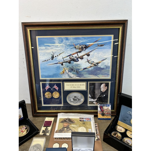 568 - A collection of coins and medals to include framed limited edition 009/299 'Victory in Europe 8th of... 