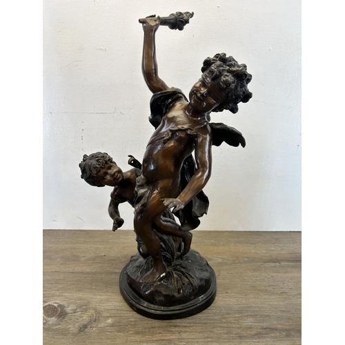 573 - A late 19th/early 20th century cast bronze blindfolded Cupid with young girl statue after Edme Bouch... 