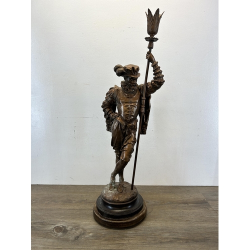 574 - A late 19th/early 20th century cast spelter cavalier statue on circular wooden base - approx. 75cm h... 