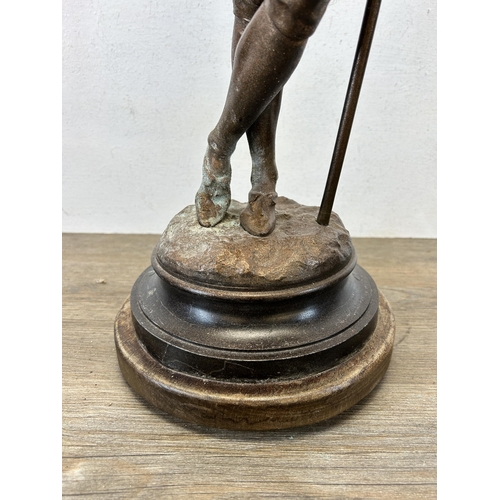 574 - A late 19th/early 20th century cast spelter cavalier statue on circular wooden base - approx. 75cm h... 