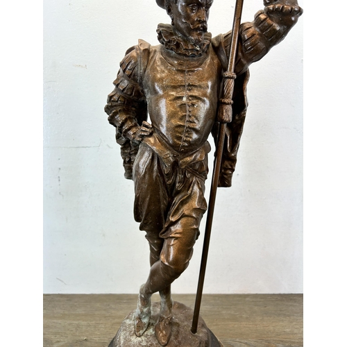 574 - A late 19th/early 20th century cast spelter cavalier statue on circular wooden base - approx. 75cm h... 